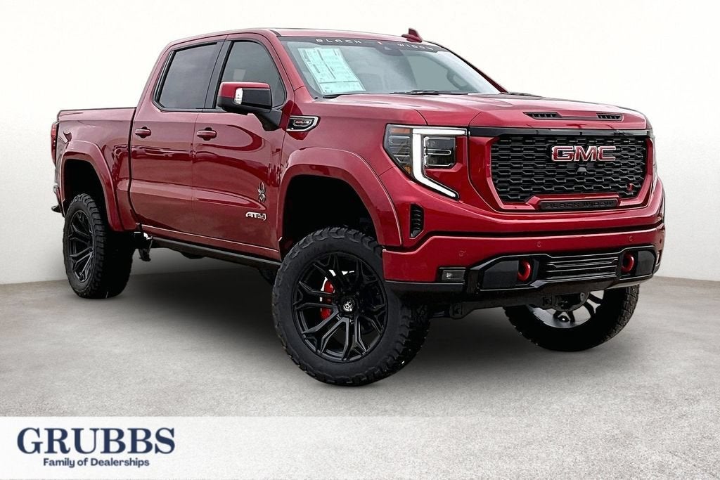 2026 GMC Sierra 1500 AT4 in Volcanic Red Tintcoat — front three-quarter view